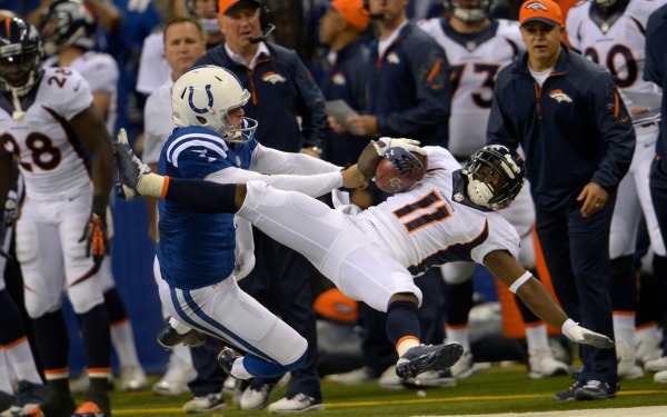 Colts punter Pat McAfee was not fined for this big hit on Trindon Holliday. ( Joe Amon/Denver Post/Getty Images)